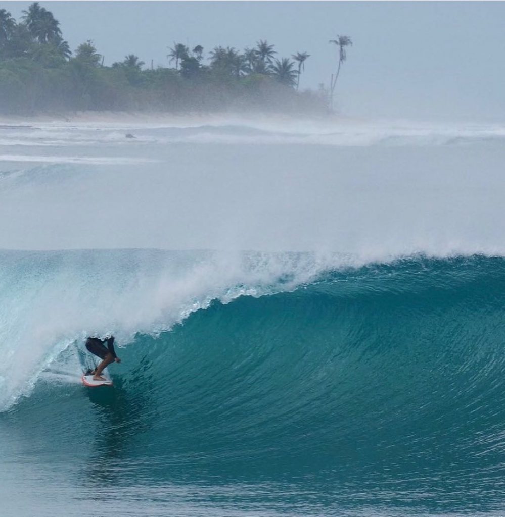 Surfer getting tubed in Indonesia